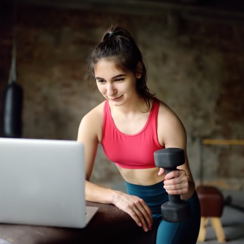 sportswoman-leads-online-fitness-class-or-herself-doing-training-using-a-laptop.jpg sportswoman-leads-online-fitness-class-or-herself-doing-training-using-a-laptop.jpg
